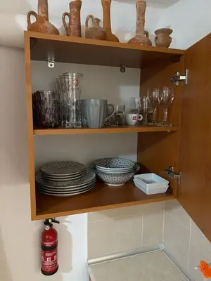 a wooden shelf with plates and bowls on it at Calle Veneziana in Chania Town