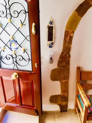 a room with a door and a stairway at Calle Veneziana in Chania Town