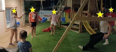 a group of children playing with stars on a playground at father's house in kissamos in Korfalónas