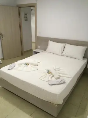 a bed with towels on top of it at Villa Martini in Kissamos