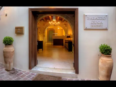 a hallway of a building with a sign that reads balaja dos at Palazzo Duca in Chania Town