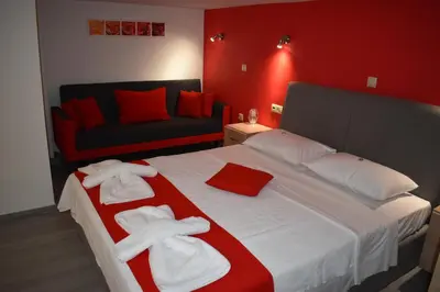 a bedroom with a large bed with towels on it at Rodoula Luxury Αpartment 2 in Chania Town