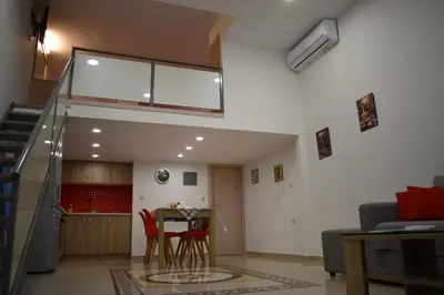 a living room with a table and chairs at Rodoula Luxury Αpartment 2 in Chania Town