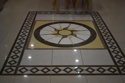 a tile floor with a clock on the floor at Rodoula Luxury Αpartment 2 in Chania Town