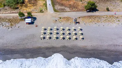 an aerial view of a parking lot with a bunch of tables at Solimar Aquamarine Resort in Gerani Chanion