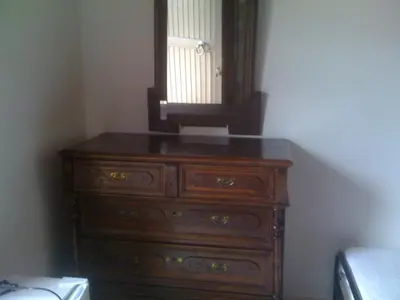 a dresser with a mirror on top of it at Oasis Guesthouse in Chania Town
