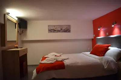 a bedroom with a bed and a sink and a mirror at Rodoula Luxury Αpartment 4 in Chania Town