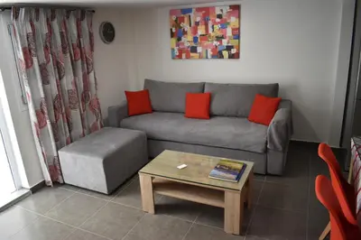 a living room with a couch and a coffee table at Rodoula Luxury Αpartment 4 in Chania Town