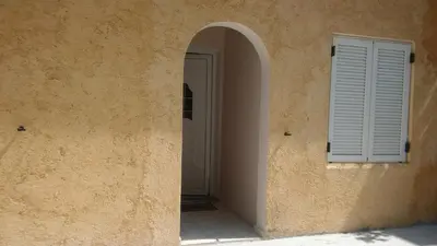 an entrance to a building with a door and a window at Sitzanaki Home in Chania Town