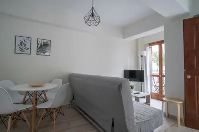 a living room with a couch and a table at Aelia Apartments in Chania Town