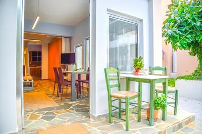 a dining room with a table and chairs at Hotel Peli in Kissamos