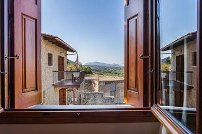 a view from an open window of a building at Olive Villas in Kría Vrísi
