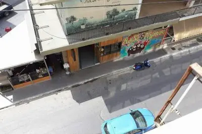 a blue car parked in front of a building at Heart City Executive Suite in Chania Town