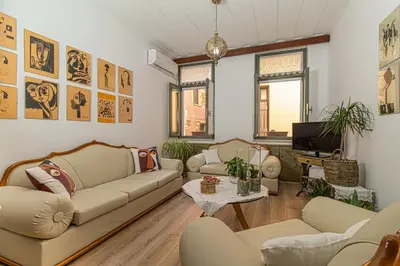 a living room with couches and a tv at Antonia Traditional Estate in Chania Town
