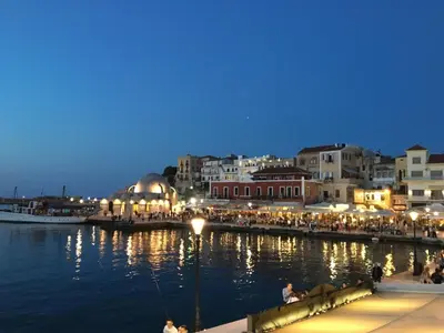 a view of a harbor at night with a group of buildings at Antonia Traditional Estate in Chania Town