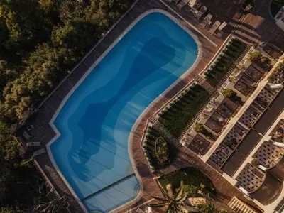 an overhead view of a large swimming pool at Royal Sun in Chania Town