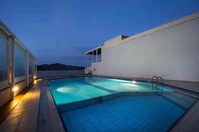 a swimming pool on the roof of a building at Georgina in Agia Marina Nea Kydonias