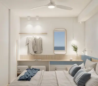 a bedroom with a bed and a mirror at Georgina in Agia Marina Nea Kydonias