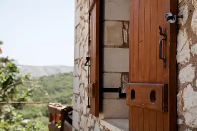 an open door of a building with a view at Tsivaras Villas in Tsivarás