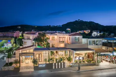 an aerial view of a building in a city at night at Oscar Suites & Village in Agia Marina Nea Kydonias