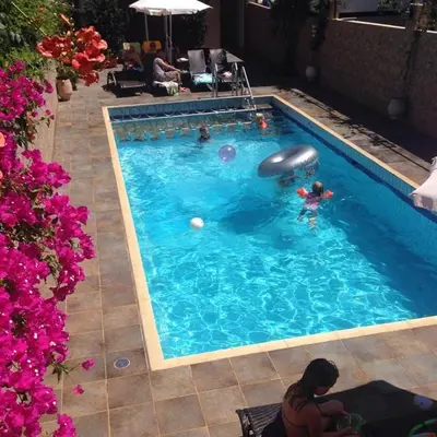 a group of people in a swimming pool at Sun Nicolas in Kato Daratso