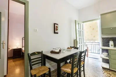 a dining room with a table and chairs at Sea View Penthouse with Roof Garden in Chania Town