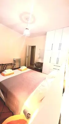 a bedroom with a large bed and a ceiling at Apartment Split Level in Chania Town