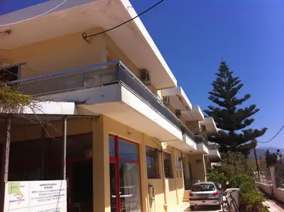 a building with a car parked in front of it at Neapolis Apartments in Palaiochóra