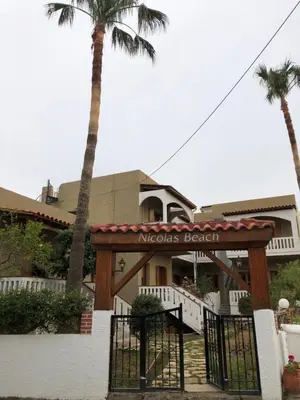 a hotel with a sign that reads mexico beach at Nicolas Beach in Palaiochóra