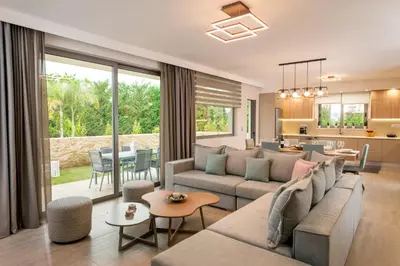 a living room with a couch and a table at Amaen Luxury House in Perivólia