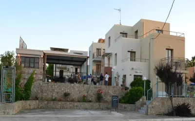 a house with a restaurant in front of it at Alexandros M in Maleme