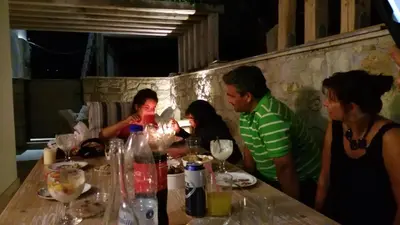 a group of people sitting around a table at Ontas Villa Loutraki Platanias in Gerani Chanion