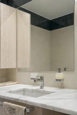 a bathroom with a large sink and a mirror at Ontas Villa Loutraki Platanias in Gerani Chanion