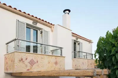 a white house with two balconies on it at Ontas Villa Loutraki Platanias in Gerani Chanion