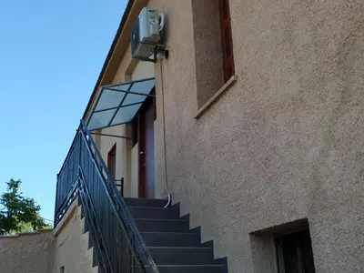 a set of stairs leading up to a building at Casa Patrikò Chania in Perivólia