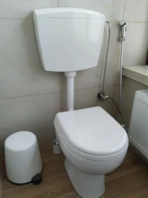a bathroom with a white toilet in a room at Casa Patrikò Chania in Perivólia