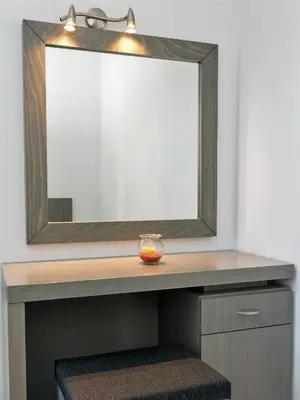 a mirror above a vanity with a bowl on it at Balito in Kato Galatas