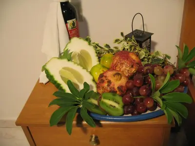 a plate of fruit on top of a table at Despina Studios in Agia Marina Nea Kydonias