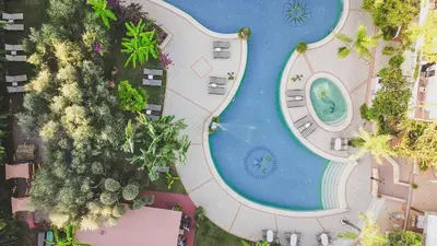 an overhead view of a swimming pool at a resort at Dionyssos Village in Kato Daratso