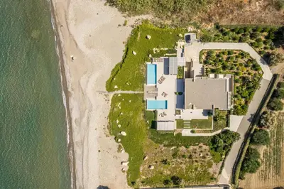 an aerial view of a building on the beach at Youphoria Beach Front Villas in Korfalónas