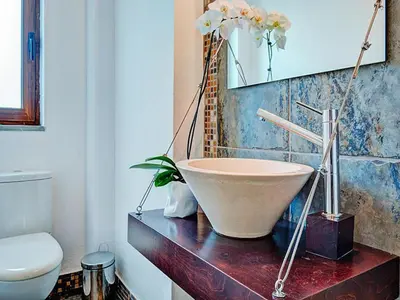 a bathroom with a bath tub sitting on a counter at Private Pool & Garden Villa for 6 in Pemónia