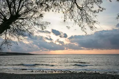 a view of the ocean from the beach at sunset at Sea Side House Rapanas in Falasarna