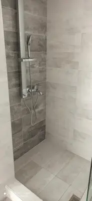 a shower with a shower head in a bathroom at Apartment in Koomkapi in Chania Town