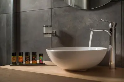 a white bowl sink on a counter in a bathroom at Mirma Luxury Apartment in Chania Town