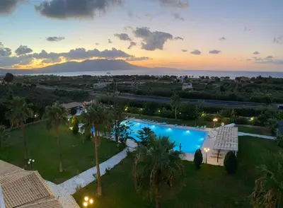 an aerial view of a resort with a swimming pool at Regina Hotel in Kissamos