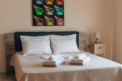 a bed with towels on top of it at Villa Stafidaki in Stalos