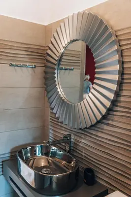 a bathroom with a sink and a mirror at Villa Stafidaki in Stalos