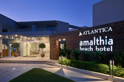 a hotel with a sign that reads atattica antilla beach hotel at Atlantica Amalthia Beach Hotel - Adults Only in Agia Marina Nea Kydonias
