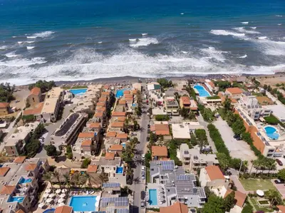 an aerial view of a resort near the ocean at Athina Suites Luxury Suites Near The Sea Platanias in Plataniás