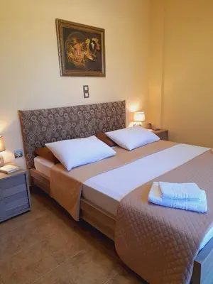 two beds in a hotel room with towels on them at 